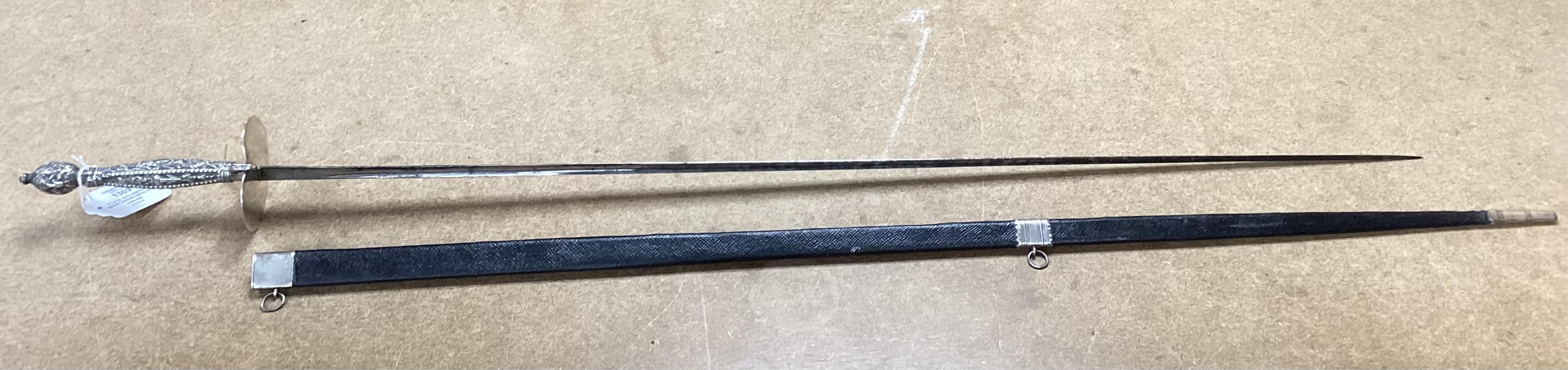 A late 18th century court sword with white metal grip, knuckle guard and mounts, decoration to scabbard band believe to be based on Admiral Duncan’s crest (Camperdown 1797), blade 84cm. Condition - fair to good, some wea